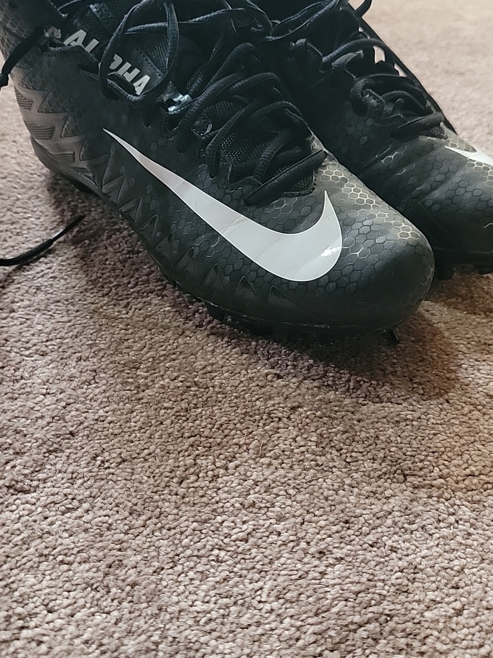Nike Black and White High-Top Athletic Cleats